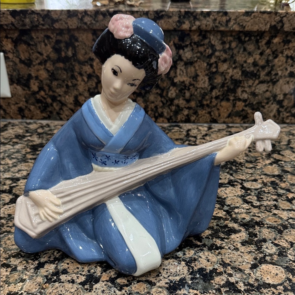 Blue and Cream Ceramic Musician Figurine